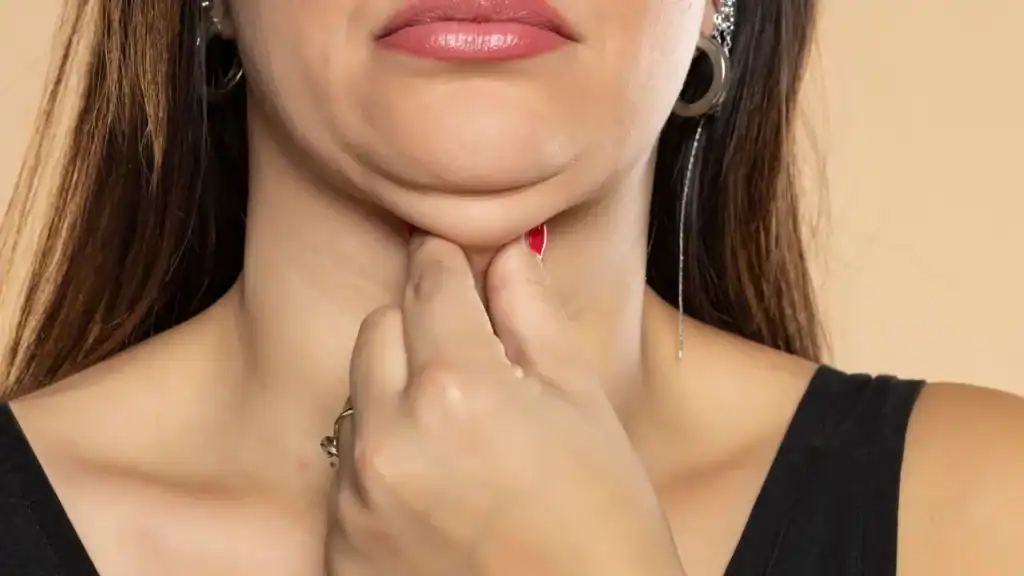 An image of a woman with double chin, sad, worried : Non Surgical Double Chin Removal Treatment in Faringdon, UK